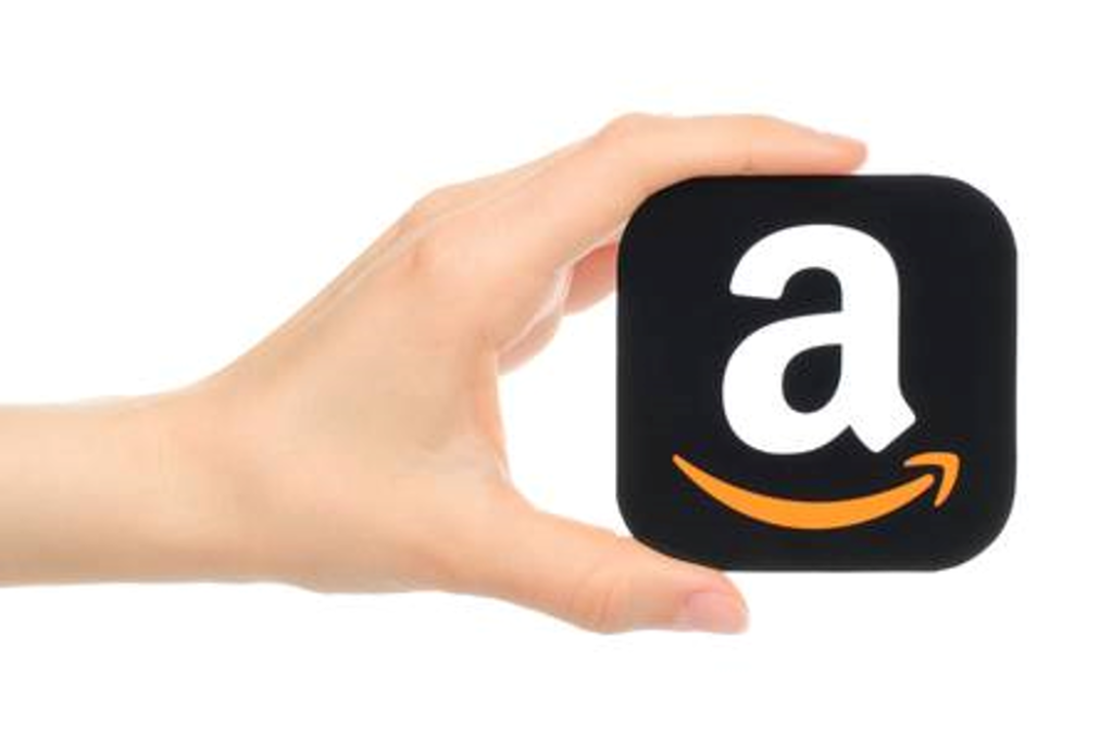 a hand holds a square with rounded edges with a lowercase letter a and a gold curved line with an arrow pointing to the right